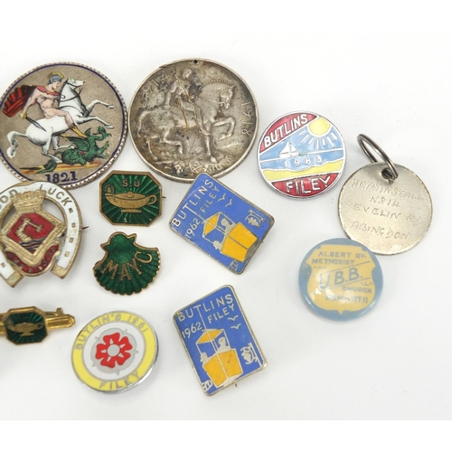 663 - Enamelled badges and coins including Butlins, George IV 1821 enamelled crown, George III 1797 cartwh... 
