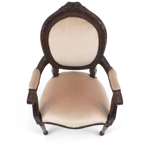 82 - Carved mahogany dolls open armchair with pink upholstery, 53cm high