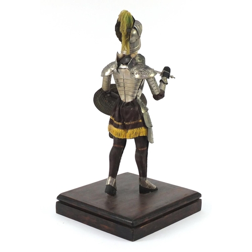 67 - Model suit of armour raised on a wooden base, 65cm high