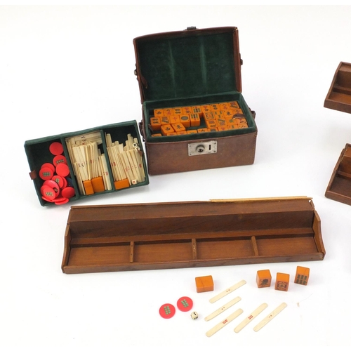 2189 - Vintage Chinese mahjong set housed in a leather case, with four oak stands