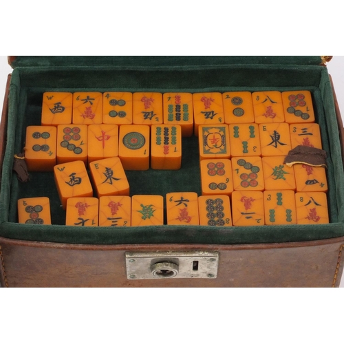 2189 - Vintage Chinese mahjong set housed in a leather case, with four oak stands