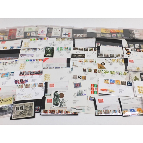 2310 - British stamps and first day covers including mint unused presentation packs, various genres and den... 