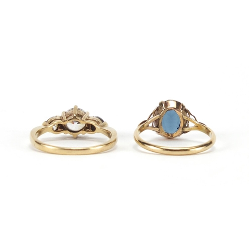 2389 - 9ct gold cubic zirconia three stone ring and a 9ct gold blue stone ring, sizes N and P, approximate ... 