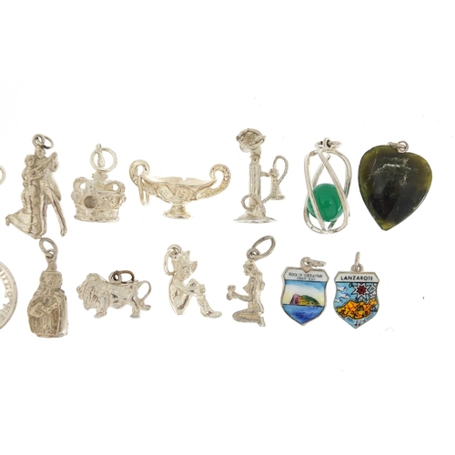 2422 - Sixteen silver charms including cottage, stick telephone and basket with swing handle, approximate w... 