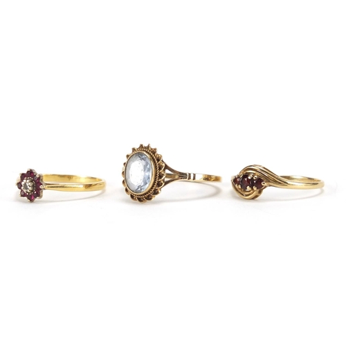 2360 - 18ct gold diamond and ruby ring and two 9ct gold rings set with garnets and blue stone, various size... 