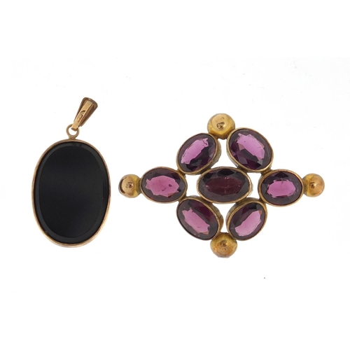 2431 - 9ct gold black onyx pendant and a Victorian gilt metal amethyst brooch, the pendant 2.7cm in length