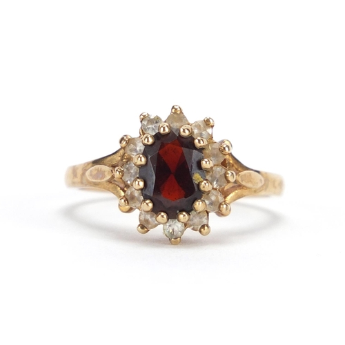 2432 - 9ct gold garnet and clear stone ring, size O, approximate weight 3.5g