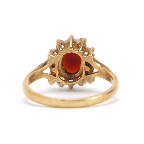 2432 - 9ct gold garnet and clear stone ring, size O, approximate weight 3.5g