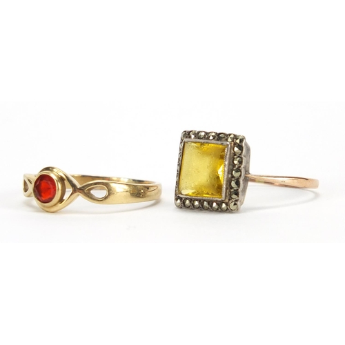 2424 - Unmarked gold garnet ring and a 9ct gold and silver marcasite ring, size U, approximate weight 6.6g