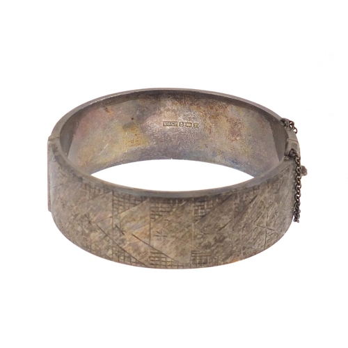 2430 - Victorian style silver bangle with engraved decoration, approximate weight 33.8g