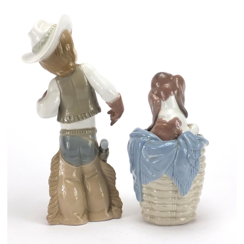 2243 - ** WITHDRAWN **Lladro figure of a cowboy and dog in a basket, the largest 26.5cm high