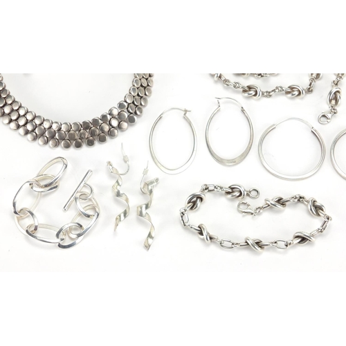 2386 - Silver and white metal jewellery including a heavy necklace, hoop earrings and bracelets, approximat... 