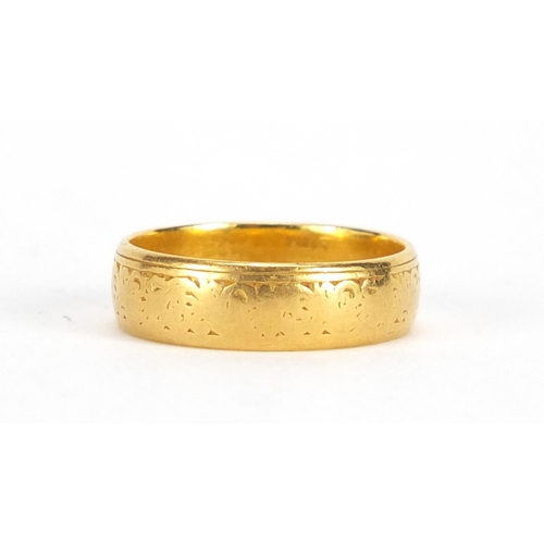 2348 - 22ct gold wedding band with engraved decoration, size O, approximate weight 5.4g