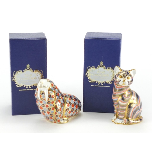 2233 - Royal Crown Derby walrus and cat paperweights with stoppers and boxes, the largest 12.5cm high
