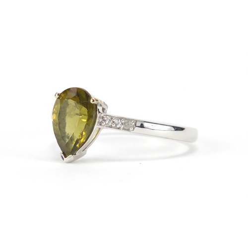 2356 - 10ct gold tear drop green stone and diamond ring, size R, approximate weight 2.6g