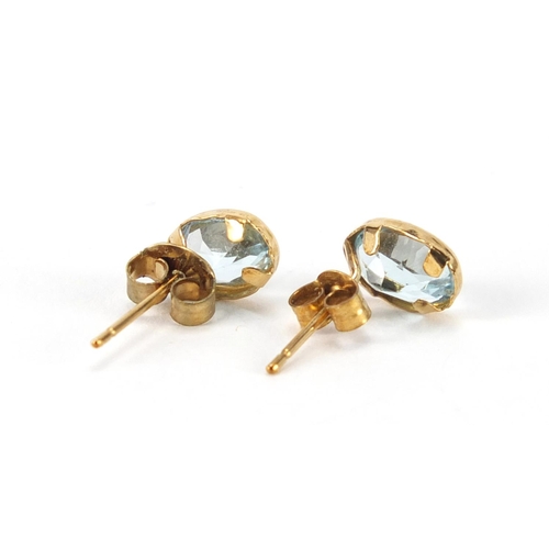 2369 - Pair of 9ct gold blue topaz earrings, 7mm in length, approximate weight 0.9g