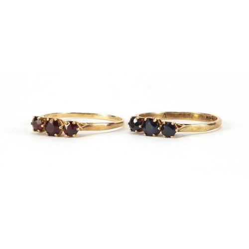 2403 - 9ct gold garnet three stone ring and 9ct gold sapphire three stone ring, both size Q, approximate we... 