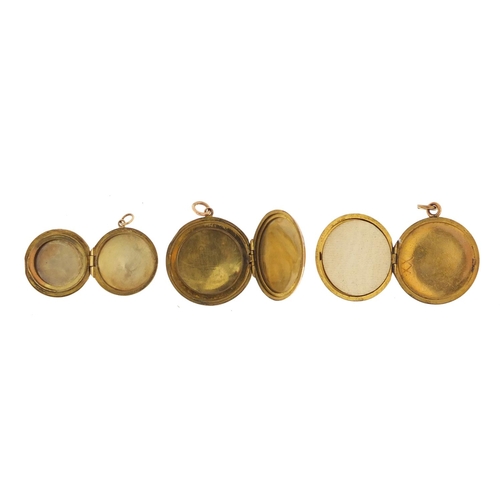 2408 - Three 9ct gold back and front lockets, one set with seed pearls, the largest 2.6cm in diameter, appr... 