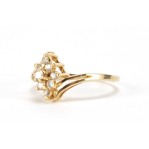 2350 - 14ct gold diamond flower head crossover ring, size L, approximate weight 2.1g