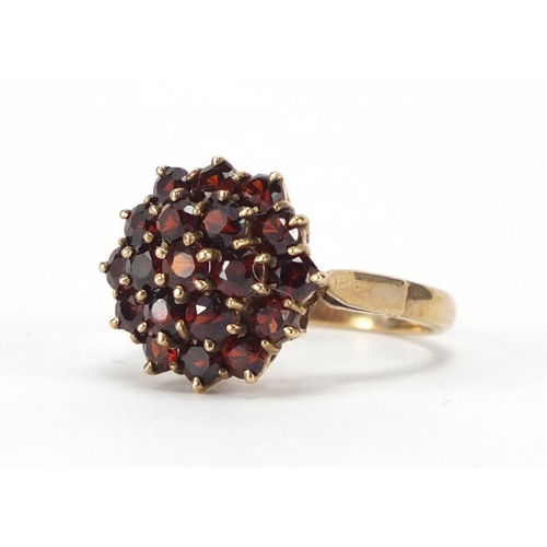2374 - 9ct gold garnet three tier cluster ring, size N, approximate weight 4.8g