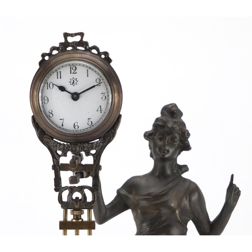 2165 - Patinated Spelter swinging mantel clock in the form of an Art Nouveau female, the clock by Junghans ... 