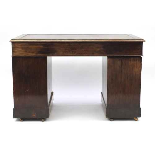 1 - Mahogany twin pedestal desk with tooled leather inset and fitted with nine drawers,  75cm H x 120cm ... 