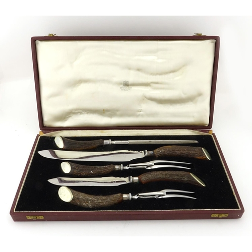 2201 - Five piece horn handled carving set, with stainless steel blades, retailed by Asprey Bond Street, ho... 
