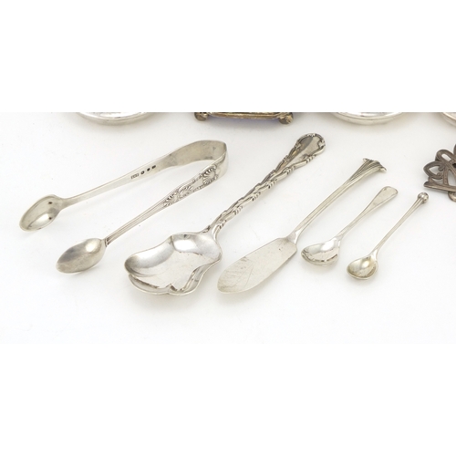 2276 - Silver items including three piece cruet, nurses buckle, spoons and sugar tongs, various hallmarks, ... 