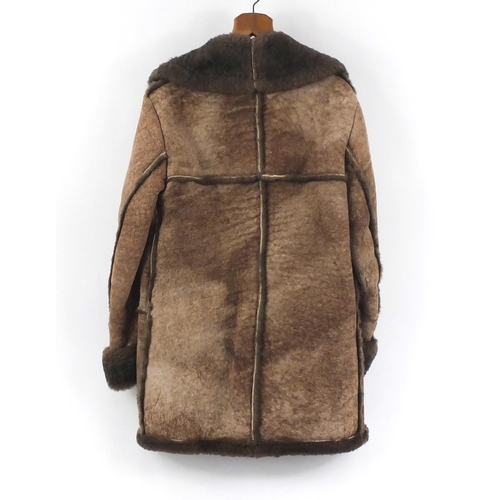814 - Gentleman's sheepskin coat with Nurseys label, 90cm in length
