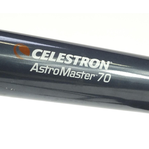 101 - Celestron Astromaster 70 telescope on tripod stand