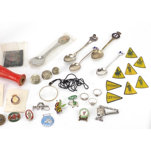 633 - Objects including silver teaspoons, silver rings, baseball tin markers, commemorative medallions and... 