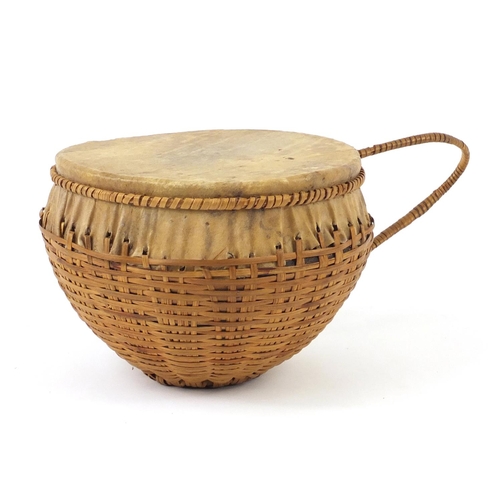 774 - Tribal nut and animal skin drum, 24cm in diameter