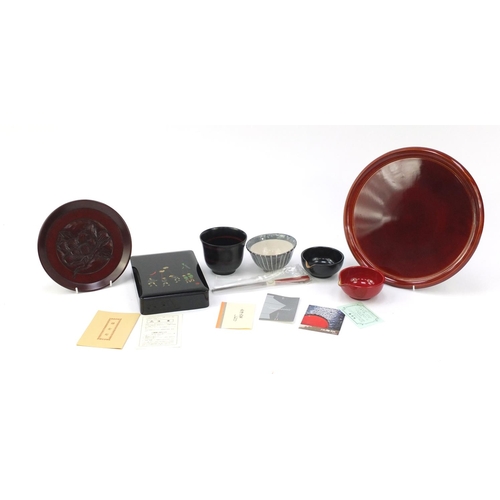 763 - Japanese lacquered items including a box and cover, circular tray and cups