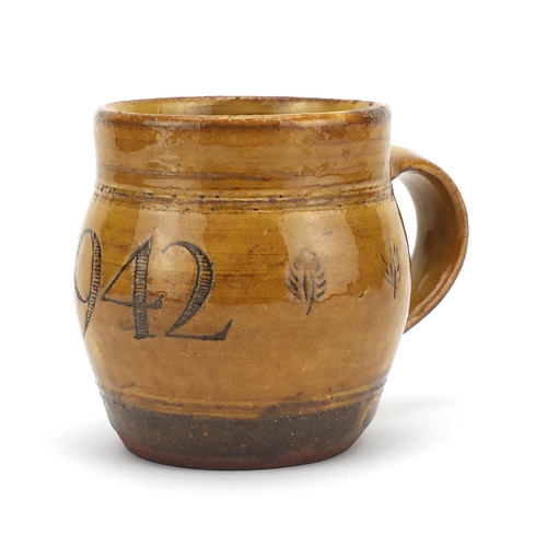 778 - Michael Cardew studio pottery jug incised and dated 1942, impressed marks, 9cm high