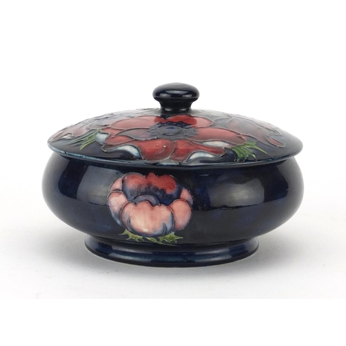 752 - Moorcroft pottery pot and cover, hand painted and tube lined in the Poppy pattern, with paper labels... 