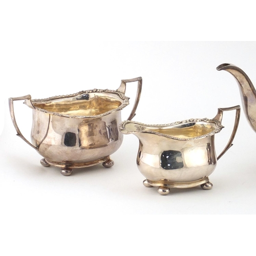 822 - Silver four piece tea and coffee service, the teapot and coffee pot with ebonised wood handle and kn... 