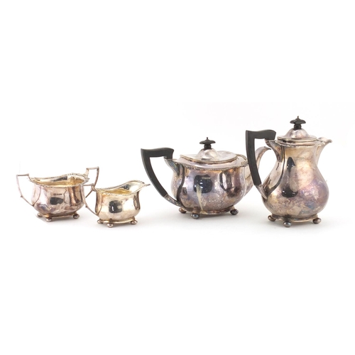 822 - Silver four piece tea and coffee service, the teapot and coffee pot with ebonised wood handle and kn... 