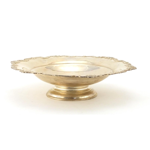 874 - Circular silver footed bowl with stylised shell shaped border, by Mappin & Webb Sheffield 1959, 24cm... 