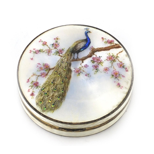 848 - Circular silver and guilloche enamelled compact, the hinged lid decorated with a peacock on a branch... 