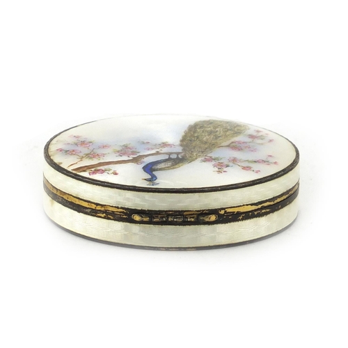 848 - Circular silver and guilloche enamelled compact, the hinged lid decorated with a peacock on a branch... 