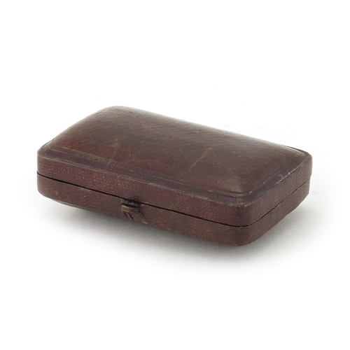 68 - Two butterscotch amber cheroots with silver mounts, housed in a fitted tooled leather box, Singleton... 