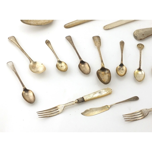 904 - Georgian and later silver flatware, some with mother of pearl handles including tablespoons, sifting... 