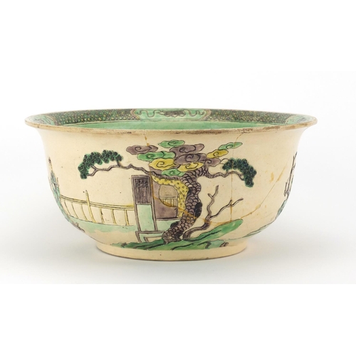 408 - Chinese famille verte pottery bowl, decorated in low relief with figures in a palace setting, six fi... 