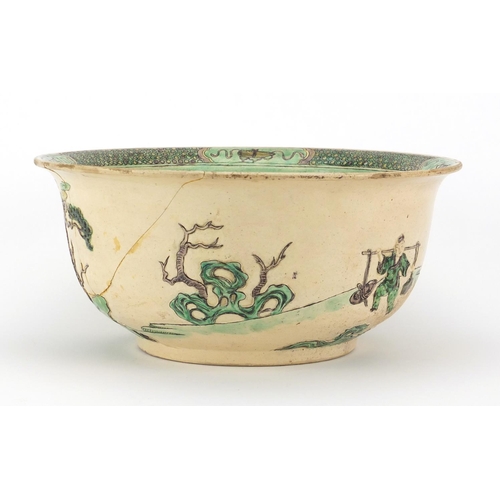 408 - Chinese famille verte pottery bowl, decorated in low relief with figures in a palace setting, six fi... 