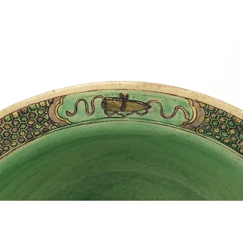 408 - Chinese famille verte pottery bowl, decorated in low relief with figures in a palace setting, six fi... 