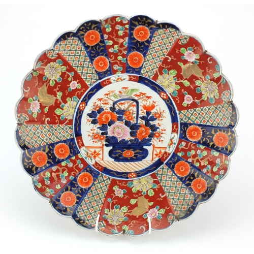 502 - Large Japanese Imari porcelain fluted charger, hand painted with flowers, 45.5cm in diameter
