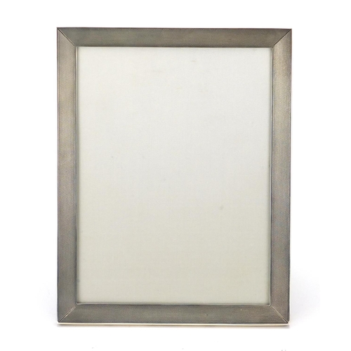840 - Rectangular silver easel photo frame with engine turned decoration, by S J Rose Son, London 1967, 23... 
