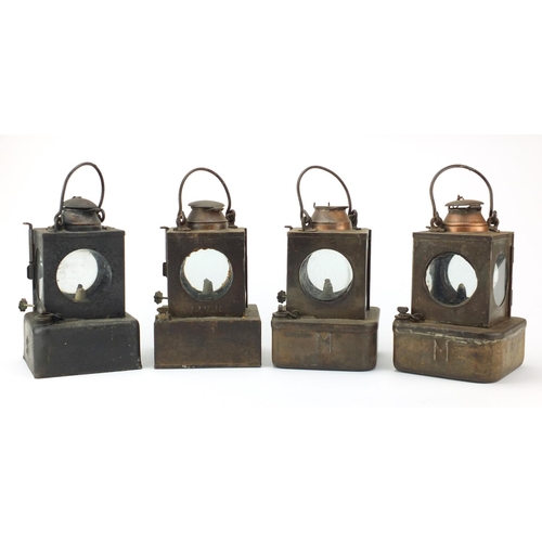 87 - Four Welch patent railway lamps, three with ceramic burners, each with various plaques including a F... 