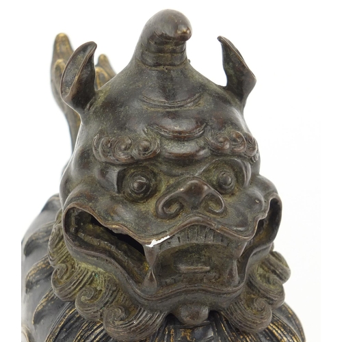 565 - Chinese patinated bronze Dog-Of-Foo incense burner, character marks to the base, 17.5cm high