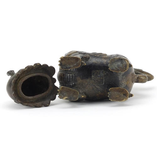 565 - Chinese patinated bronze Dog-Of-Foo incense burner, character marks to the base, 17.5cm high